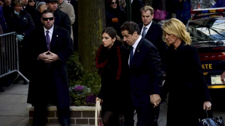 New York Gov. Andrew M. Cuomo arrives for the wake of his father, former Gov. Mario Cuomo, at Frank E. Campbell Funeral Home in Manhattan on Monday, Jan. 5, 2015. With the governor are his daughter, Michaela, left, and girlfriend Sandra Lee. Mario Cuomo died Jan. 1, 2015 at age 82.