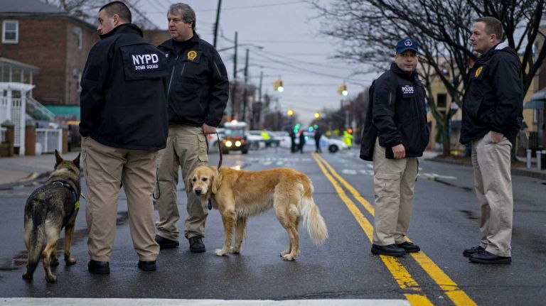 NYPD bomb squad detectives work the site in Brooklyn, where thousands of police officers and others are expected for the funeral Jan. 4, 2015 of Det. Wenjian Liu, one of two officers slain on Dec. 20. 