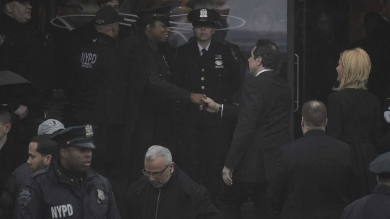 Gov. Andrew M. Cuomo and his girlfriend, Sandra Lee, arrive at the wake of Det. Wenjian Liu at Aievoli Funeral Home in Brooklyn on Saturday, Jan. 3, 2015.