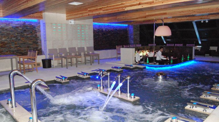 Premier 57 by Spa Castle features tubs, pools, saunas and a swim-up bar 30 The indoor bade pool is the heart of Premier 57. It features a standing neck shower, hydro jets, floating jets and bubble seats at the Aqua Bar. Yes, there's a swim up, full-service bar located in the pool. Tinted windows with views of New York City line the pool, with lounge chairs all around.