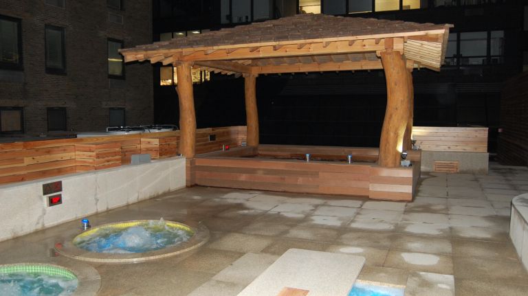 Premier 57 by Spa Castle features tubs, pools, saunas and a swim-up bar 34 The Hinoki bath is the centerpiece of the roof deck. A bade pool built with