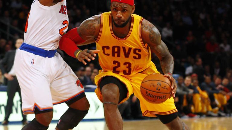 LeBron James of the Cleveland Cavaliers drives to the hoop against Iman Shumpert of the New York Knicks in the second half at Madison Square Garden on Thursday, Dec. 4, 2014.