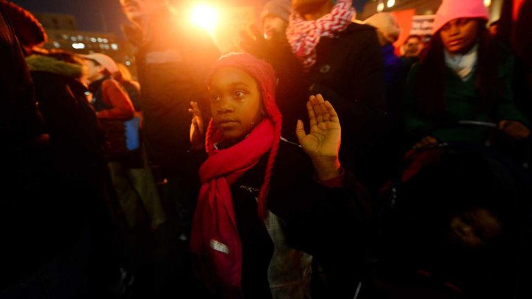 Crowds gather Thursday, Dec. 4, 2014, at Foley Square to protest the grand jury's decision not to indict an NYPD officer in the death of Eric Garner.