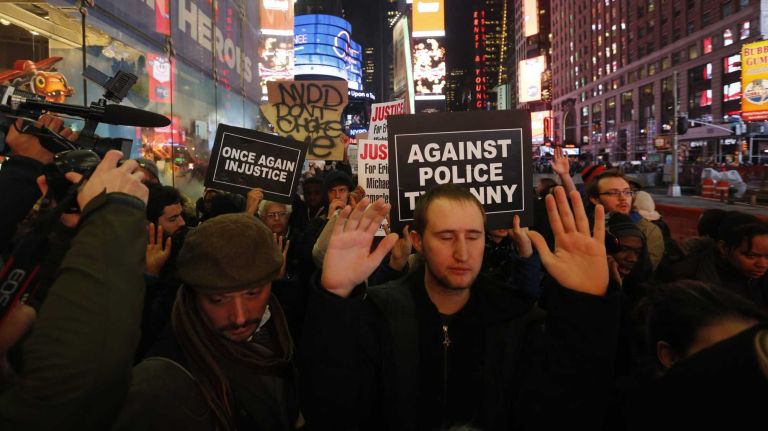 Protesters march through Manhattan on Wednesday, Dec. 3, 2014, after a grand jury decided not to indict NYPD Officer Daniel Pantaleo in the July death of Eric Garner.