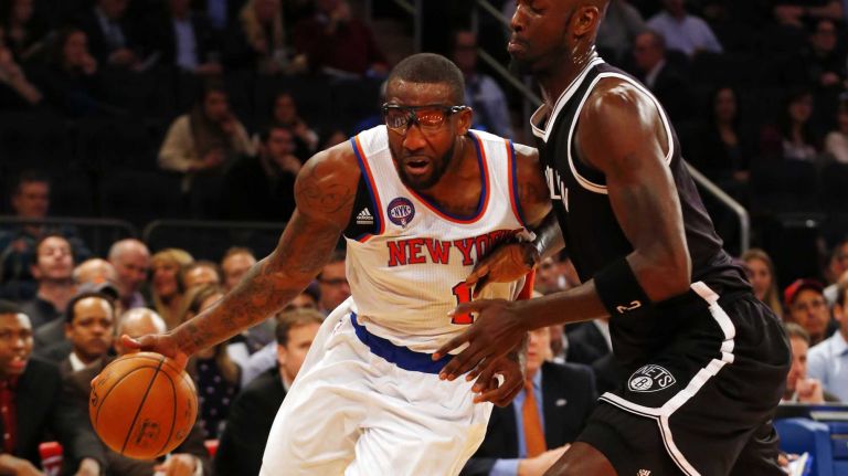 Knicks vs. Nets 19 Amar'e Stoudemire of the New York Knicks drives against Kevin Garnett of the Brooklyn Nets in the first half at Madison Square Garden on Tuesday, Dec. 2, 2014.