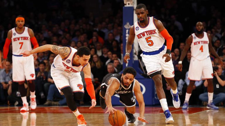 Knicks vs. Nets 20 Jorge Gutierrez of the Brooklyn Nets and Shane Larkin of the New York Knicks reach for a loose ball in the first half at Madison Square Garden on Tuesday, Dec. 2, 2014.