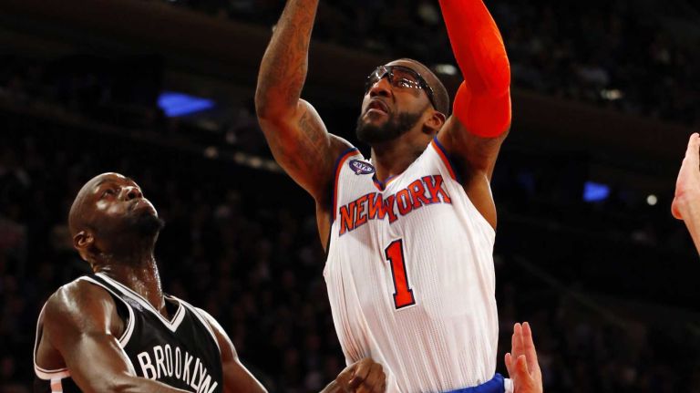 Knicks vs. Nets 21 Amar'e Stoudemire of the New York Knicks puts up a shot for a basket in the first half against the Brooklyn Nets at Madison Square Garden on Tuesday, Dec. 2, 2014.