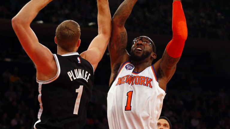 Knicks vs. Nets 23 Amar'e Stoudemire of the New York Knicks grabs a rebound against Mason Plumlee of the Brooklyn Nets at Madison Square Garden on Tuesday, Dec. 2, 2014.
