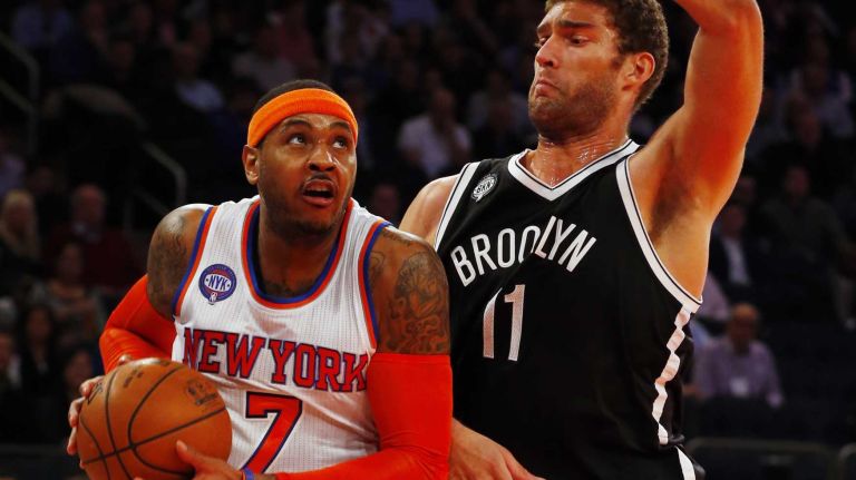 Knicks vs. Nets 25 Carmelo Anthony of the New York Knicks tries to drive to the hoop in the first half against Brook Lopez of the Brooklyn Nets at Madison Square Garden on Tuesday, Dec. 2, 2014.