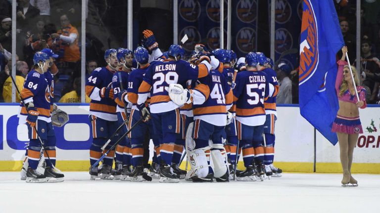 Islanders vs. Senators 28 The New York Islanders, including goalie Jaroslav Halak, celebrate their win in overtime against the Ottawa Senators in an NHL game at Nassau Coliseum on Tuesday, Dec. 2, 2014.