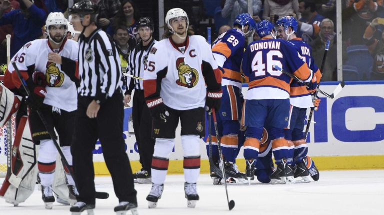 Islanders vs. Senators 29 The New York Islanders, including center Brock Nelson, defenseman Matt Donovan and defenseman Thomas Hickey celebrate the winning goal by Hickey against the Ottawa Senators in overtime in an NHL game at Nassau Coliseum on Tuesday, Dec. 2, 2014.