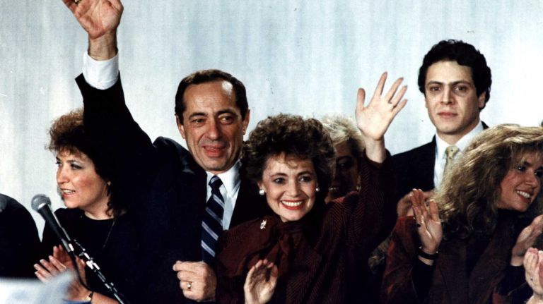 Surrounded by his family, New York Gov. Mario Cuomo, left, makes a victory speech at Sheraton Center in Manhattan on Nov. 4, 1986.