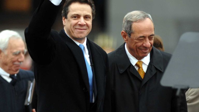 After being sworn in as governor, Andrew M. Cuomo greets the crowd with his father Mario Cuomo at his side in West Capital Park outside the Capital building in Albany during the gubernatorial inaugural ceremony, Monday, Jan. 1, 2007.