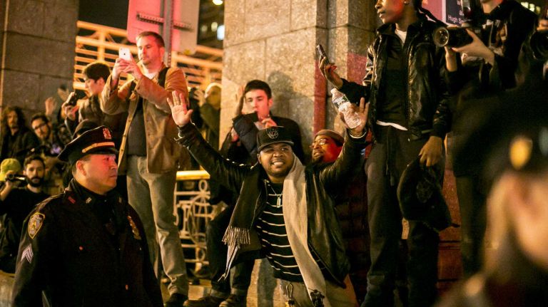 Protesters gather in Lower Manhattan on Tuesday, Nov. 25, 2014, in response to the grand jury decision regarding the fatal shooting of Michael Brown in Ferguson, Mo.