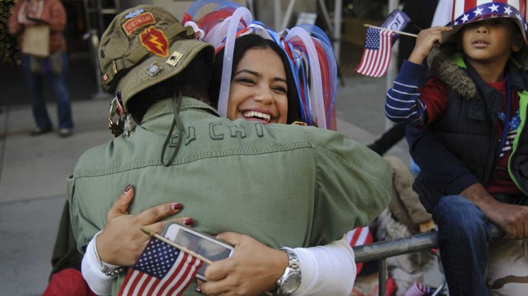 NYC Veterans Day Parade in images 17 Vietnam veteran Laurence Lynch hugs Kelly Sosa during the 95th annual New York City Veterans Day Parade on Tuesday, November 11, 2014.