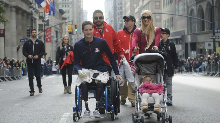 NYC Veterans Day Parade in images 18 Iraq veteran and triple amputee Brian Kolface, left, attends the 95th annual New York City Veterans Day Parade on Tuesday, November 11, 2014.