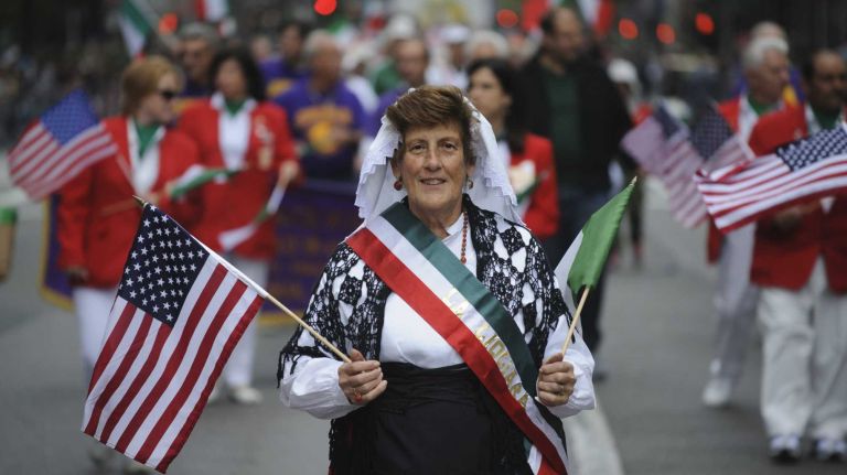 A group of people march with the Order Sons of Italy in America, John Michael Marino Lodge No. 1389 in Port Washington, NY, during in the 70th Annual Columbus Day Parade in Manhattan, Monday, Oct. 13, 2014.