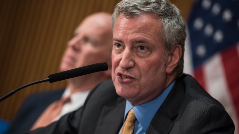 Mayor Bill de Blasio and Police Commissioner James O'Neill discuss crime statistics at a news conference on May 8.