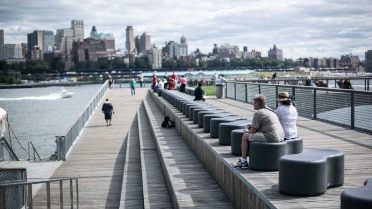 People sit on the East Side Esplanade