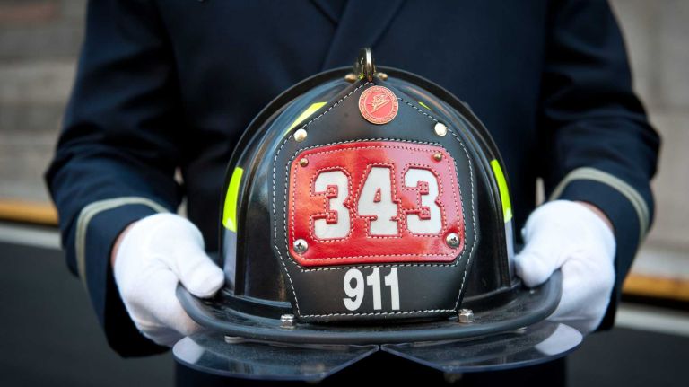 Firefighter Frank Hudec of Ladder 79 looks on as runners exit the Hugh L. Carey Tunnel on Sunday, Sept. 28, 2014, during the annual Stephen Siller Tunnel to Towers Run that honors fallen 9/11 heroes.