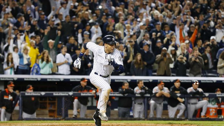 Derek Jeter's final game at Yankee Stadium 98 Derek Jeter of the Yankees runs to first base after hitting a ninth-inning, game-winning base hit against the Baltimore Orioles at Yankee Stadium on Thursday, Sept. 25, 2014.