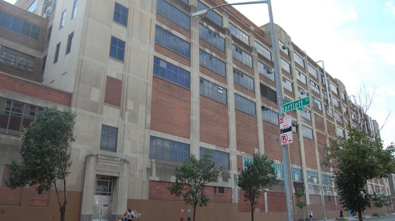 The former Pfizer building runs the entire length of Flushing Avenue, from Tompkins Street to Marcy Avenue, at the border of Bed-Stuy and Williamsburg.