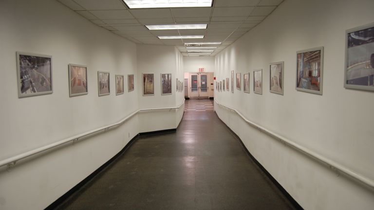 The history of the building is apparent when you first enter. The hallway leading to the elevators is lined in photographs of life in the pharmaceutical plant. 