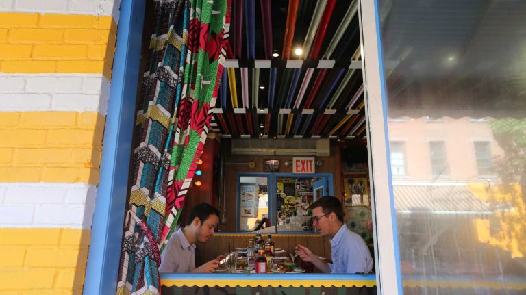 Diners at Miss Lily's 7A Cafe, at 109 Ave. A.