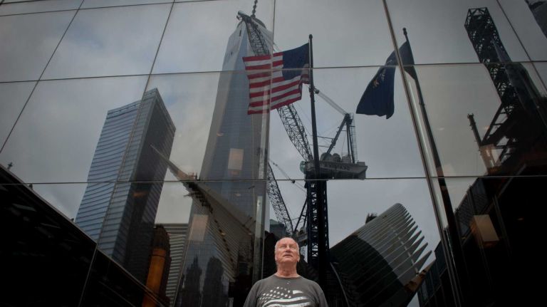 Tyrone McClave of Pennsylvania looks over the World Trade Center site today, Sept. 11, 2014 on the 13th Anniversary of the terror attacks.