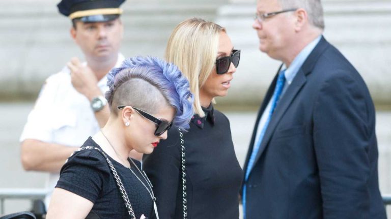 Kelly Osbourne arrives at Temple Emanu-El in Manhattan before a private funeral for Joan Rivers on Sunday, Sept. 7, 2014.