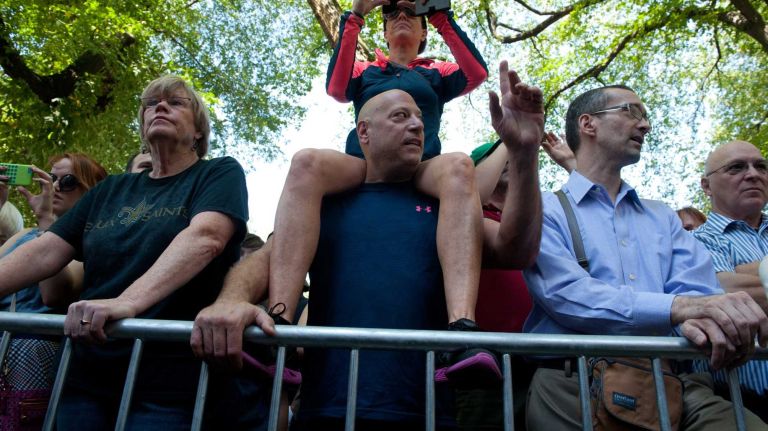 Crowds of Joan Rivers fans line the streets near Temple Emanu-El in Manhattan before a private funeral for Joan Rivers on Sunday, Sept. 7, 2014.