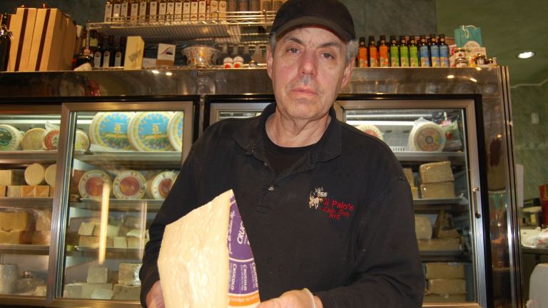 Lou Di Palo proudly shows off a delicious Piave, or mountain cheese, named after a river that flows from the Italian Alps.
