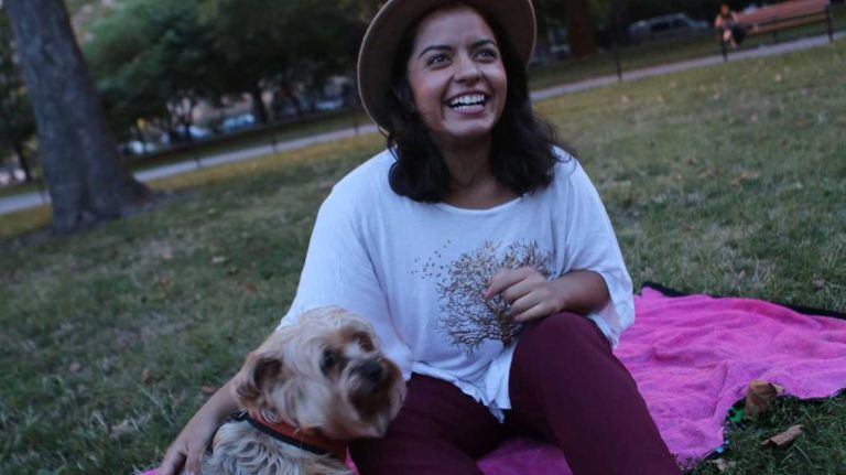Williamsburg resident Isabel Montoya, 23, showed off her favorite accessory-- her Yorkie, Bebe-- while catching some shade in McCarren Park.