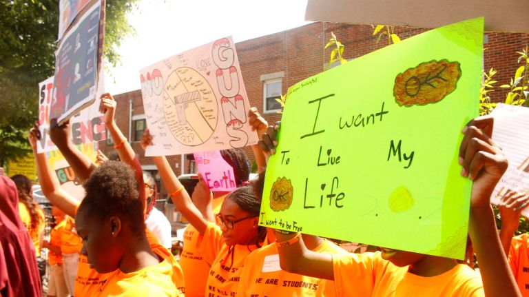 Approximately 200 students walked out of Launch Expeditionary Learning Charter School to protest gun violence in Brooklyn on Friday. 