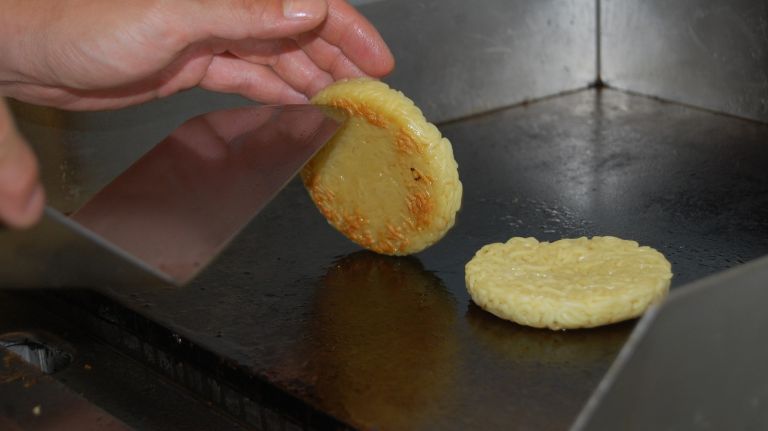 Keizo Shimamoto won't divulge his secret for keeping the noodles together. So the first step we know of is to put the buns on the heat. Let each side cook for a 1-2 minutes or until browned. Flip and repeat. 