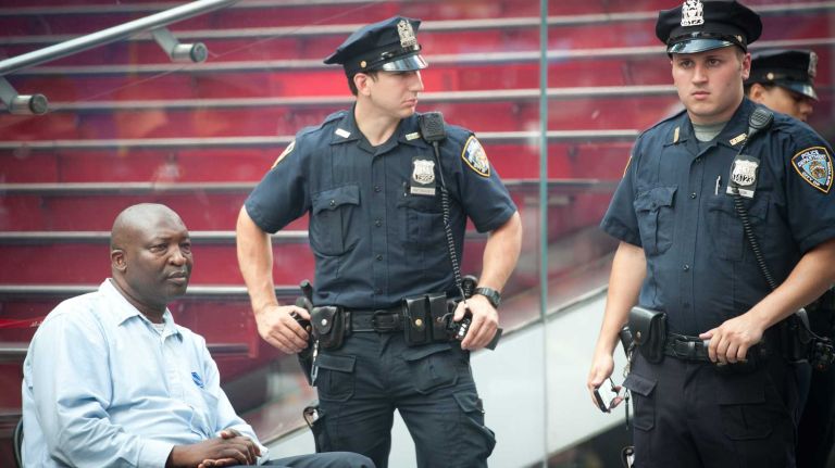 The driver of one of two double-decker buses that collided near Times Square, at West 47th Street and Seventh Avenue, is seen after the crash on Tuesday, Aug. 5, 2014. 