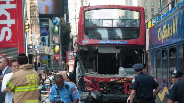 At least 14 people were injured after two double-decker tour buses collided near Times Square, at West 47th Street and Seventh Avenue, on Tuesday, Aug. 5, 2014.