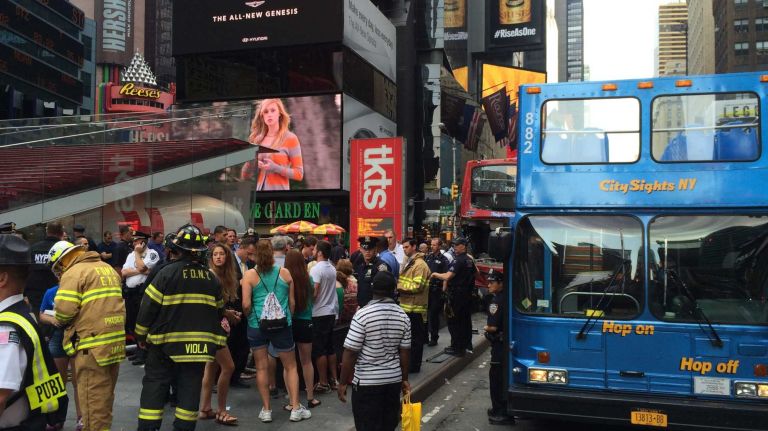 Emergency personnel respond to the scene after two tour buses collided in Times Square Tuesday, Aug. 5, 2014, injuring passengers, the FDNY said.