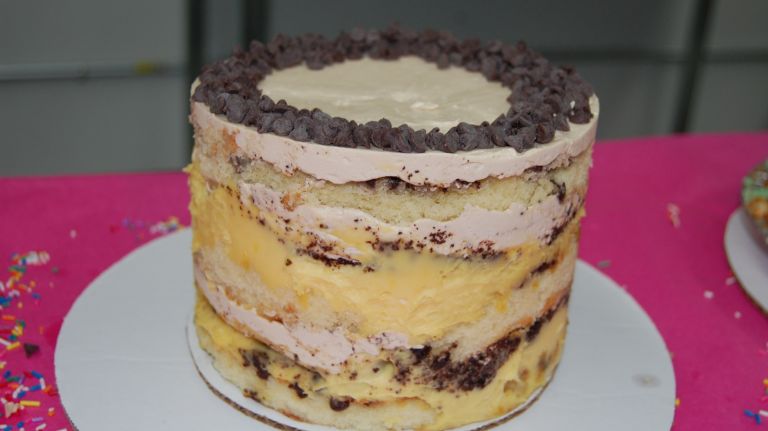 This chocolate chip cake is soaked with passion fruit puree and layered with passion fruit curd, chocolate crumbs and rich coffee frosting. 