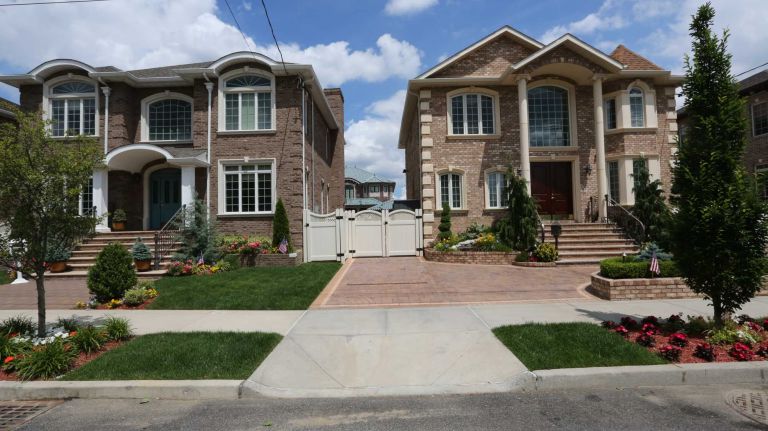 Houses along 83rd street near 165th ave. in Howard Beach, Queens, Thursday, June 26, 2014.