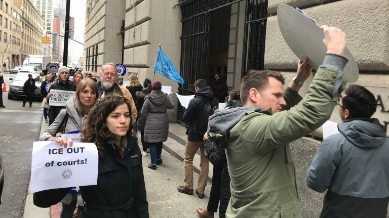 Legal Aid Society attorneys protest the arrest of an immigrant by ICE agents at Brooklyn criminal court in April. 