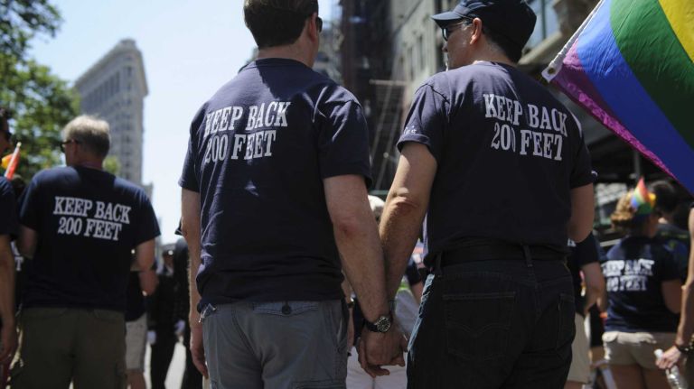 Members of Fire FLAG/EMS walk during the New York City pride parade in Manhattan on Sunday, June 29, 2014.