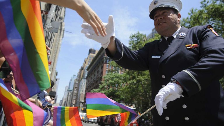 Lieutentant Anthony Almojera, a New York City EMS Paramedic walks in the New York City pride parade in Manhattan on Sunday, June 29, 2014.