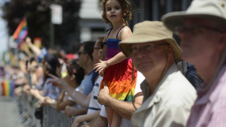 Spectators participate during the New York City pride parade in Manhattan on Sunday, June 29, 2014.