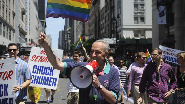 Sen. Charles E. Schumer walks during the pride parade in Manhattan on Sunday, June 29, 2014.