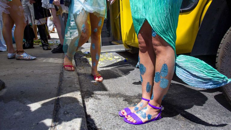 People with the Rockaway Mermaid Brigade prepare for the annual Coney Island Mermaid Parade on Saturday, June 21, 2014, before the parade kicks off.