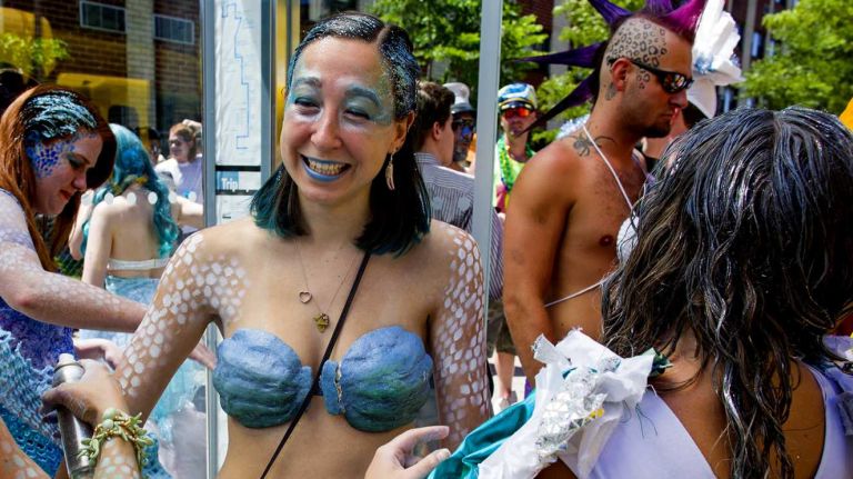 People with the Rockaway Mermaid Brigade prepare for the start of the annual Coney Island Mermaid Parade on Saturday, June 21, 2014.
