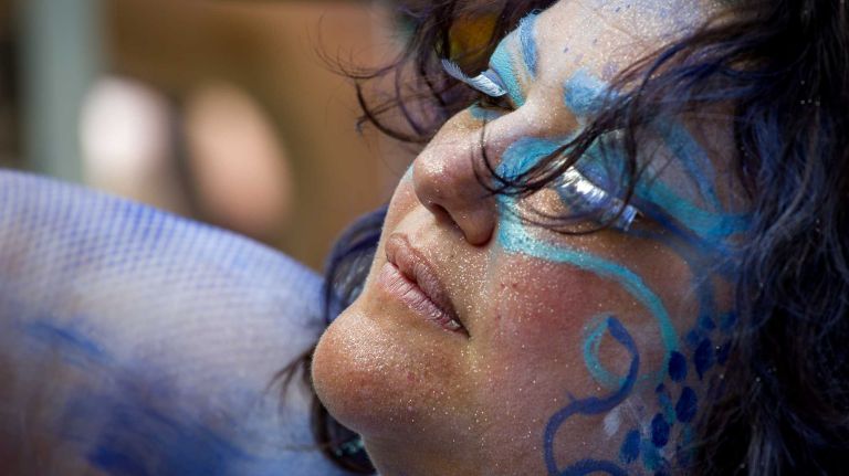 People with the Rockaway Mermaid Brigade prepare for the start of the annual Coney Island Mermaid Parade on Saturday, June 21, 2014.
