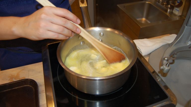 Éclair recipe from Bouchon Bakery 19 Combine the water, butter, sugar and salt in a medium saucepan, place over medium heat and stir as the butter melts. (Starting at too high a temperature will evaporate some of the water before the butter has melted.) Once the butter has melted, increase the heat to medium-high and bring to a simmer, then remove the pan from the heat.