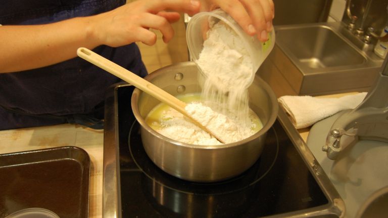 Éclair recipe from Bouchon Bakery 20 With a stiff heatproof or wooden spoon, stir in all of the flour. Continue to stir for about 2 minutes, or until the mixture has a paste-like consistency.